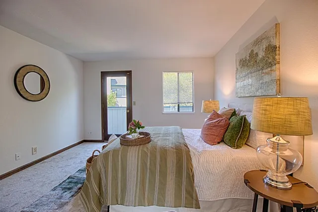 a bedroom with a bed and window