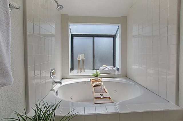 a bed room with a bed and a window