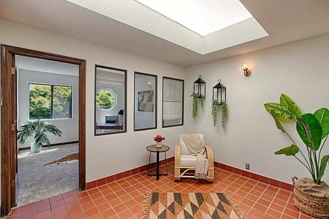 a view of a bedroom with bed and hallway