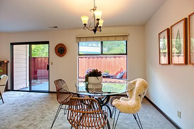a dining room with furniture and window