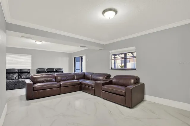 a living room with furniture a couch and a window