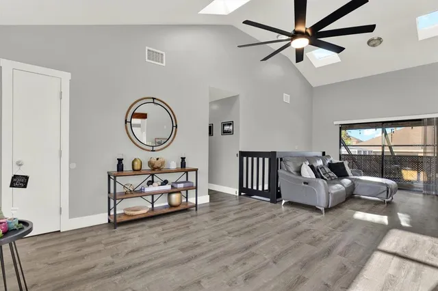 a living room with furniture or couch and a large window