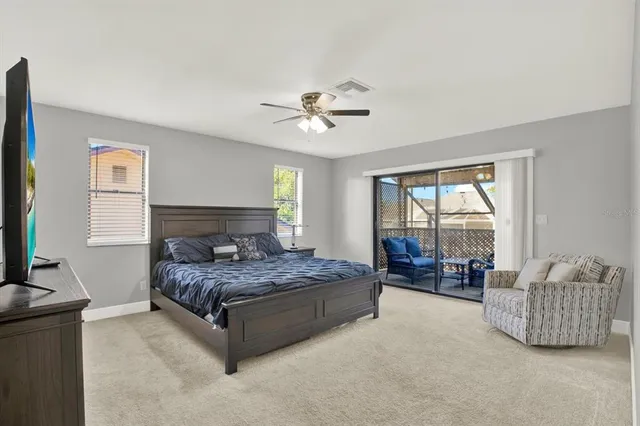 a bedroom with a bed and a couch