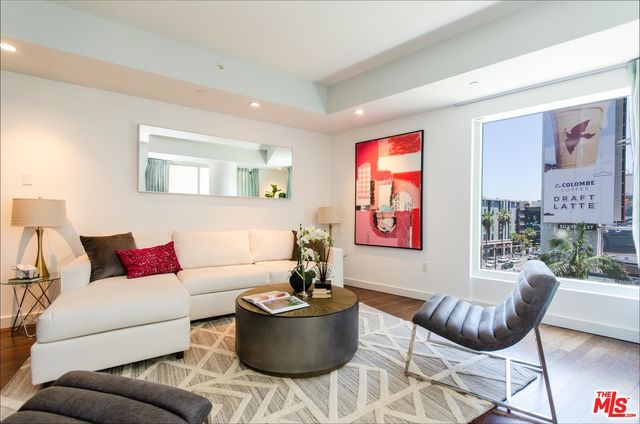 a living room with furniture and rug