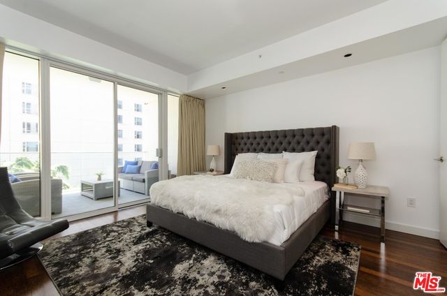 a spacious bedroom with a large bed and a window