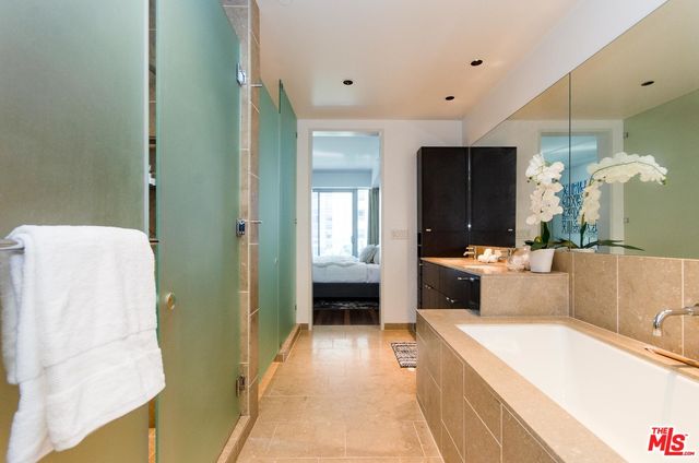 a bathroom with a bathtub and shower