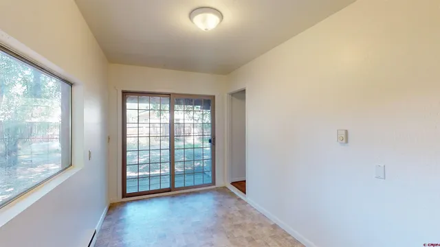 a view of an empty room with a window