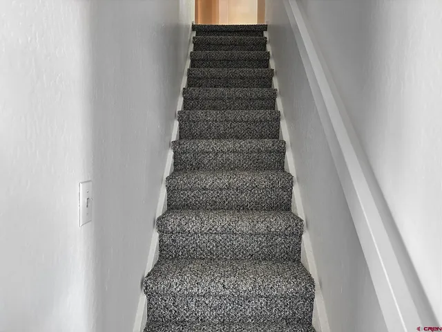 a view of a hallway with closet area