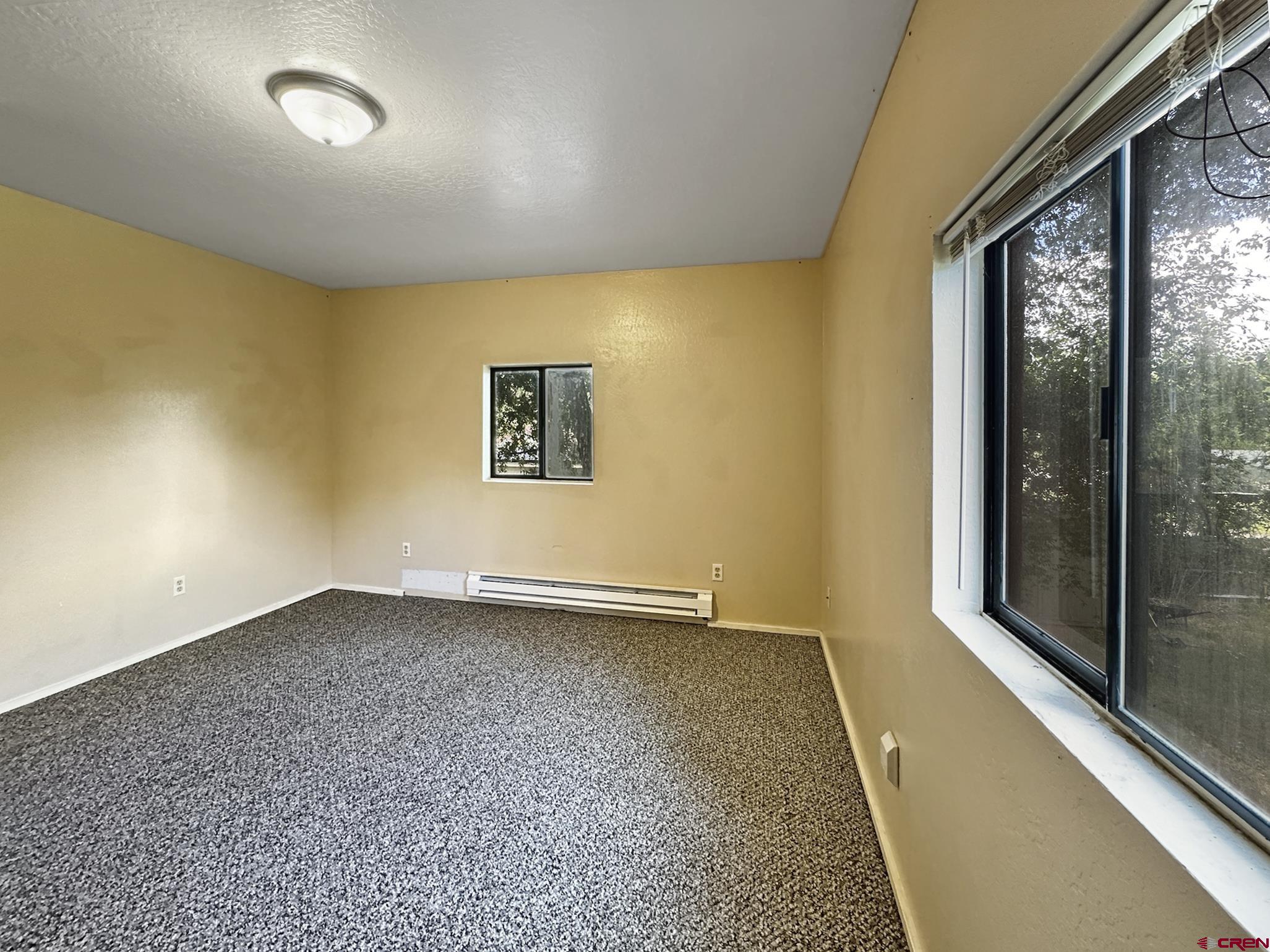 438 Stahl Road Paonia, CO 81428 - Photo 26 of 33 an empty room with windows