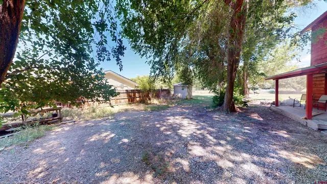 a view of backyard with green space
