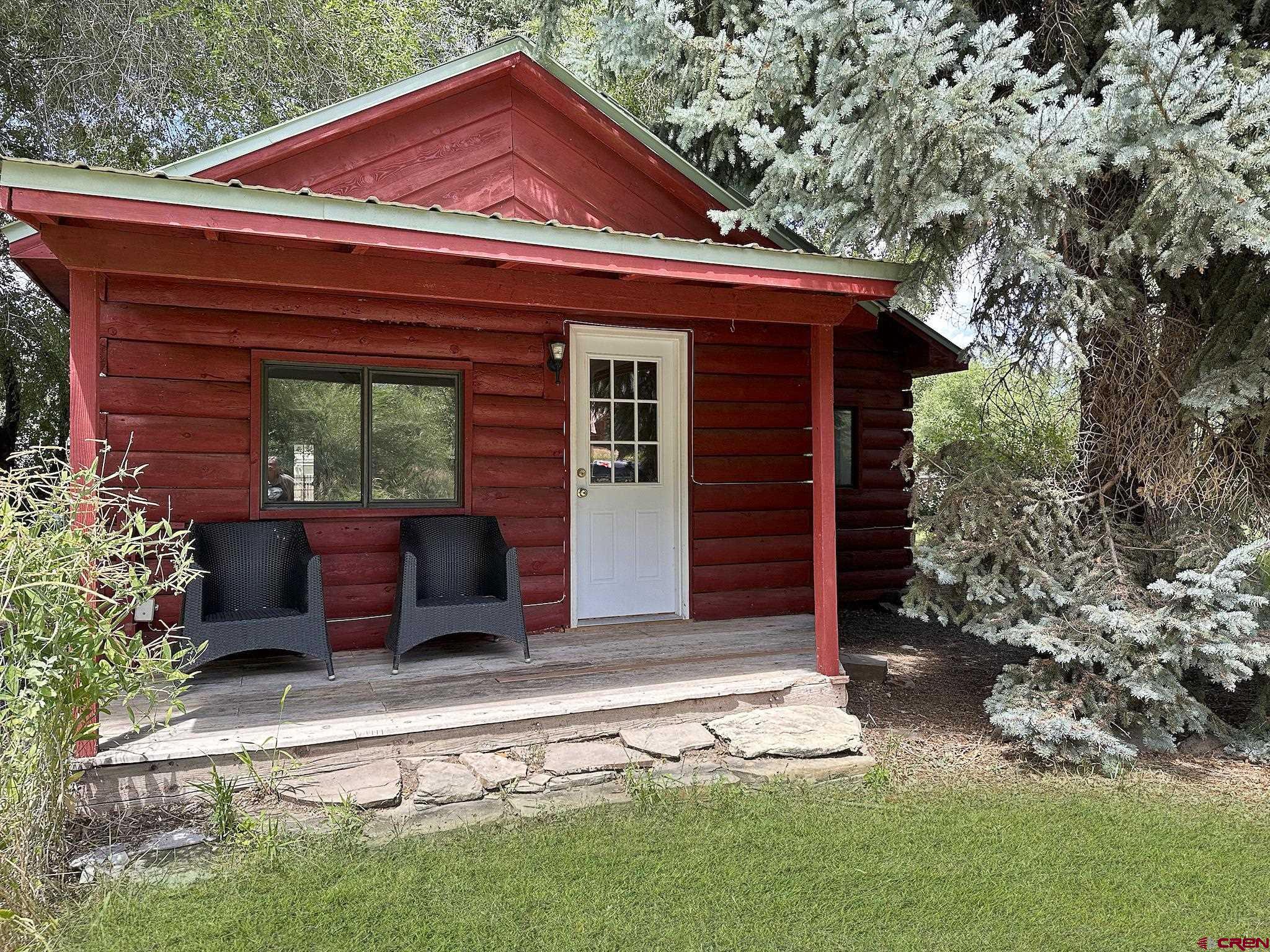 438 Stahl Road Paonia, CO 81428 - Photo 7 of 33 a front view of a house with a garden