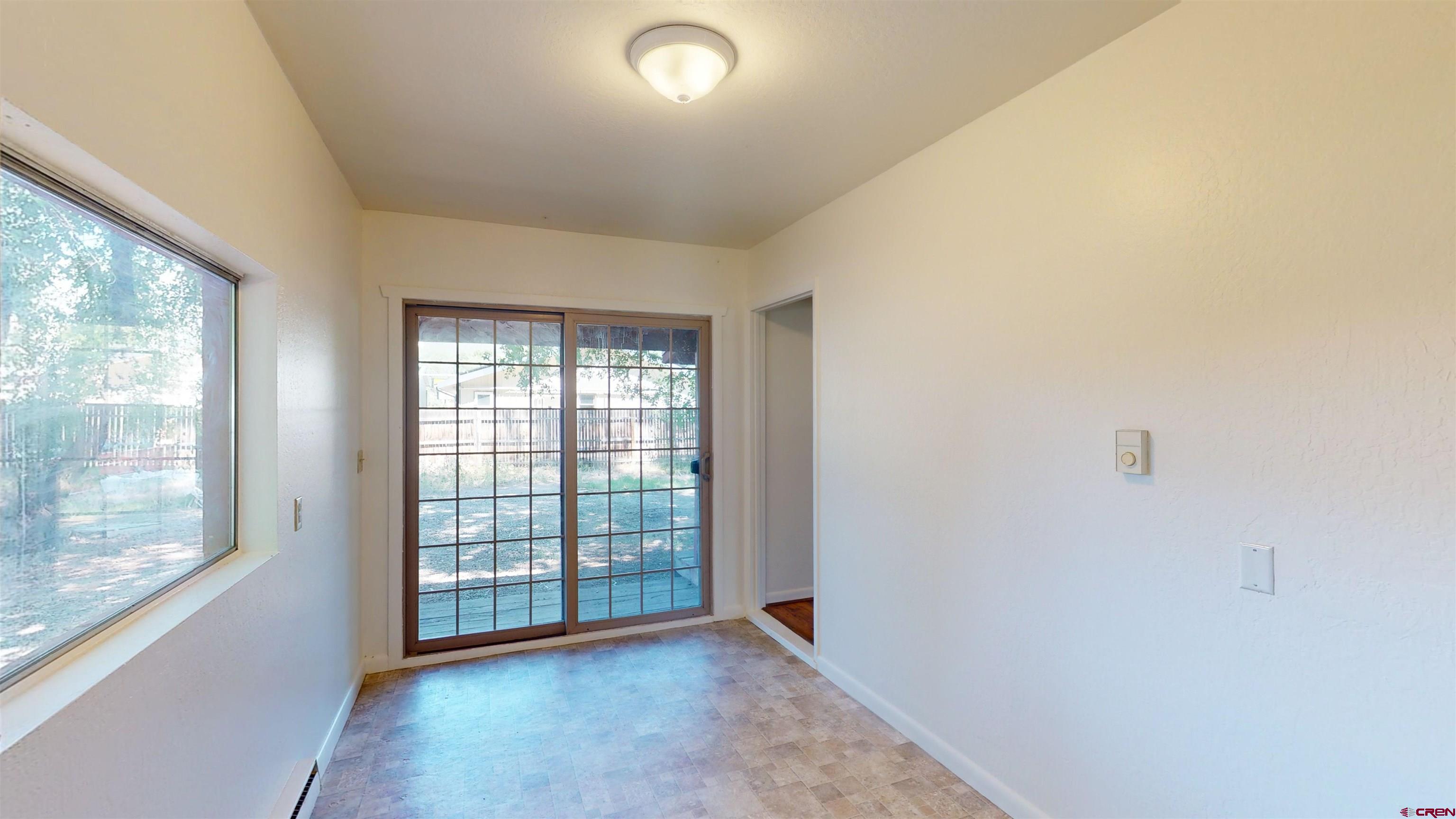 438 Stahl Road Paonia, CO 81428 - Photo 9 of 33 a view of an empty room with a window