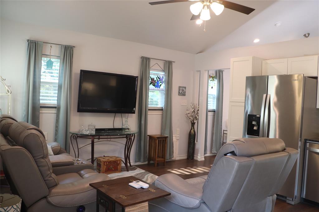 5614 Pleasant Ridge Road Dallas, TX 75236 - Photo 17 of 23 a living room with furniture and a flat screen tv