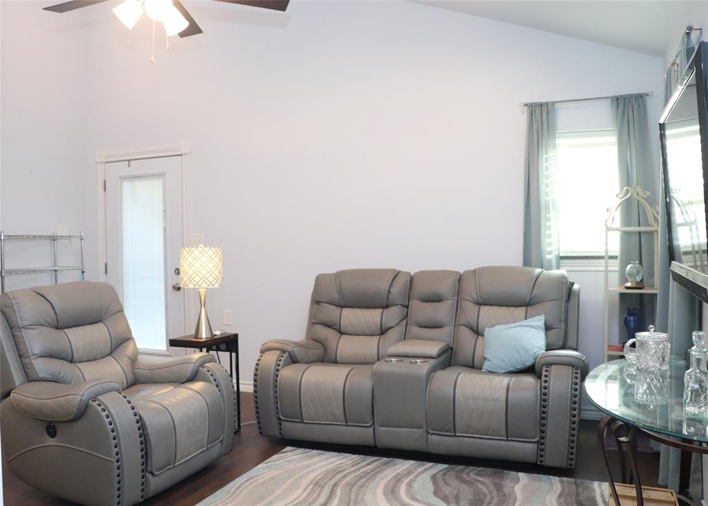 5614 Pleasant Ridge Road Dallas, TX 75236 - Photo 18 of 23 a living room with furniture and a large window