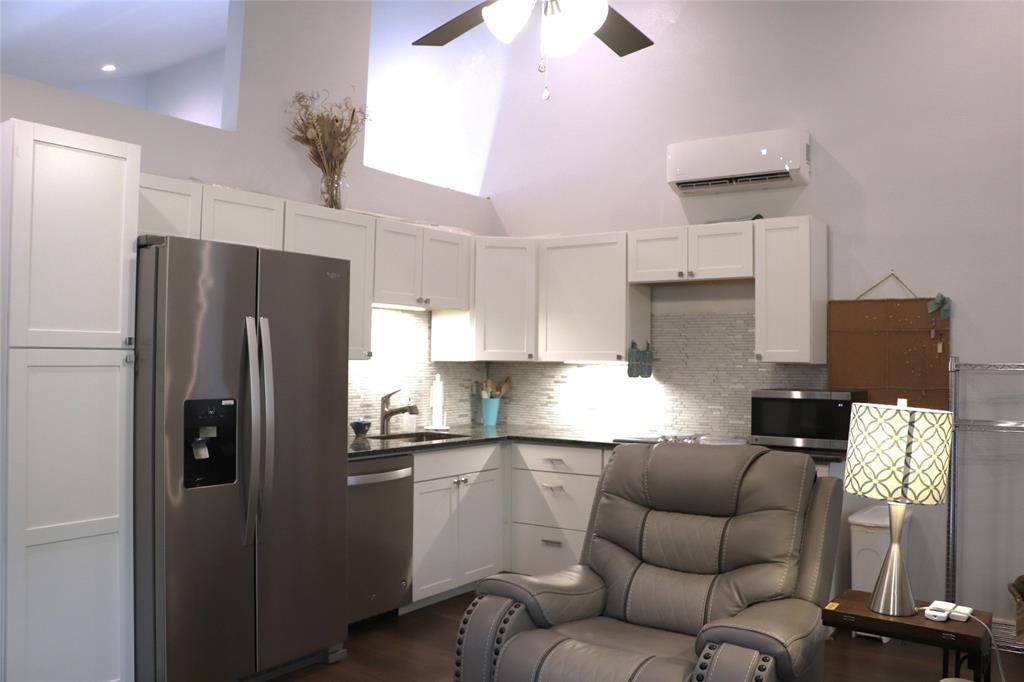 5614 Pleasant Ridge Road Dallas, TX 75236 - Photo 21 of 23 a kitchen with stainless steel appliances granite countertop a refrigerator a sink dishwasher a stove and a refrigerator