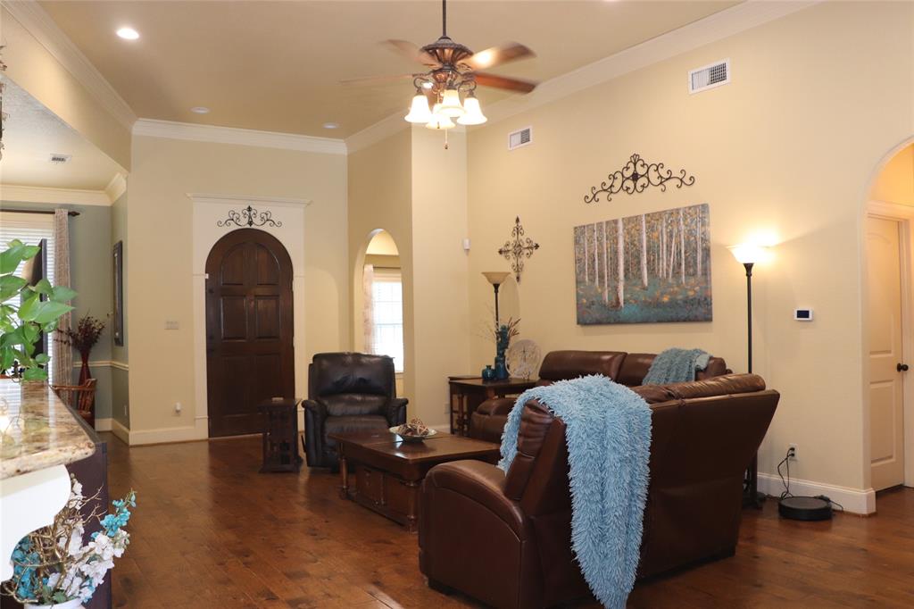 5614 Pleasant Ridge Road Dallas, TX 75236 - Photo 5 of 23 a living room with furniture and a chandelier