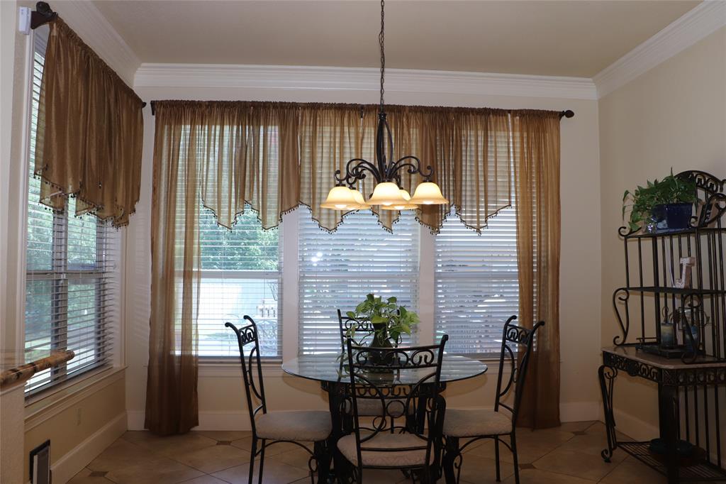 5614 Pleasant Ridge Road Dallas, TX 75236 - Photo 8 of 23 a dining room with furniture and window