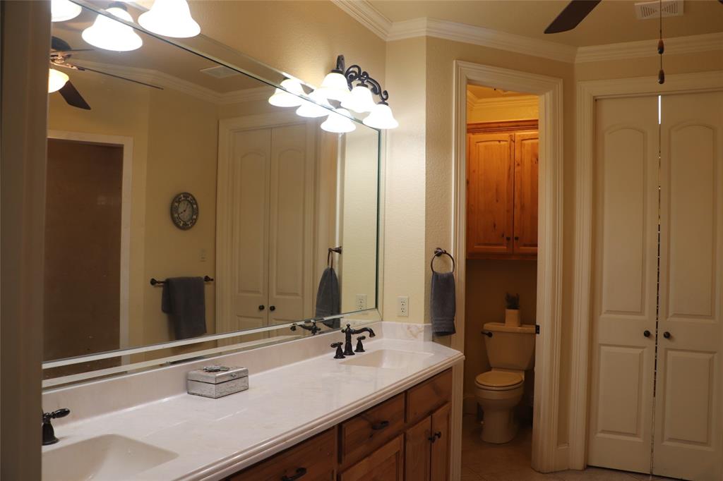 5614 Pleasant Ridge Road Dallas, TX 75236 - Photo 10 of 23 a bathroom with a sink vanity granite and a mirror