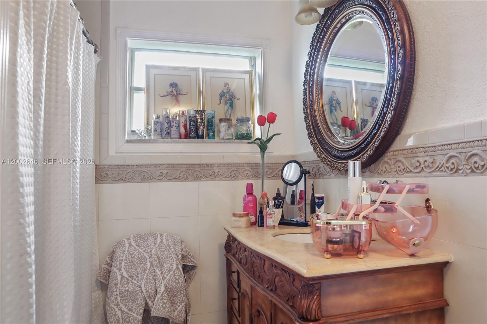 619 Southwest 39th Avenue Miami, FL 33134 - Photo 11 of 24 a bathroom with a sink and a mirror