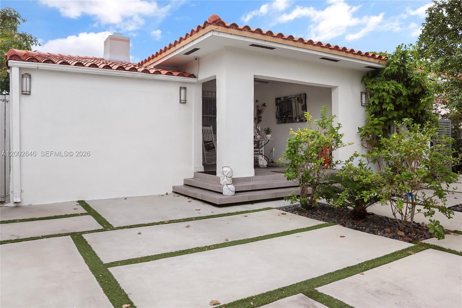 619 Southwest 39th Avenue Miami, FL 33134 - Photo 2 of 24 a view of the house with potted plants