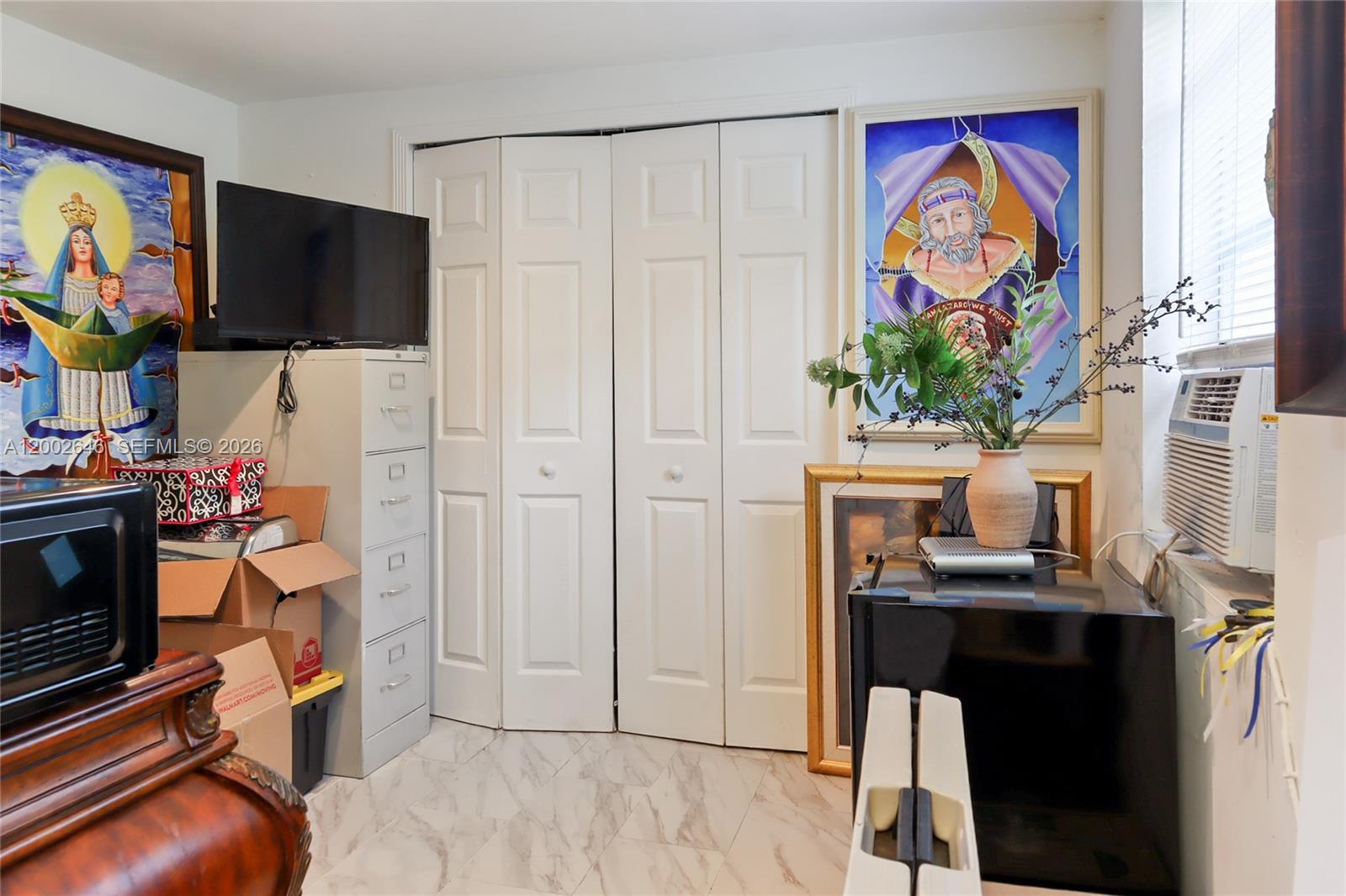 619 Southwest 39th Avenue Miami, FL 33134 - Photo 22 of 24 a view of a workspace with furniture and flat screen tv