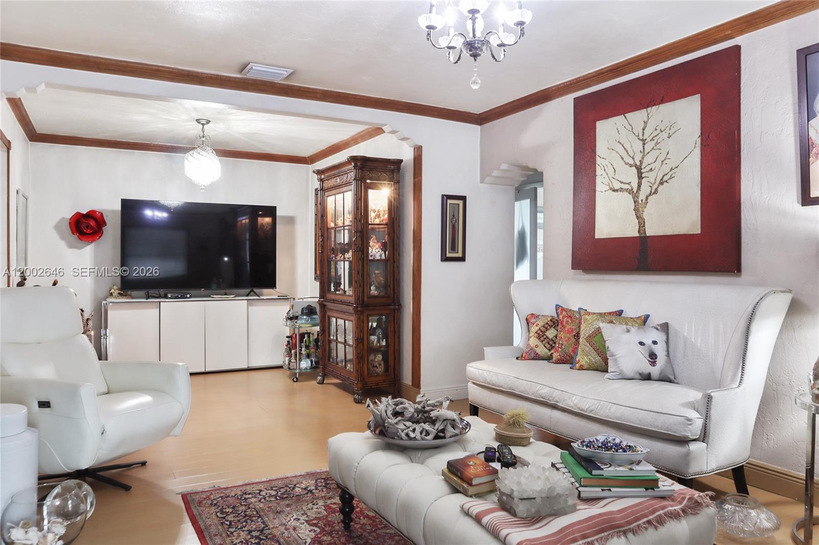 619 Southwest 39th Avenue Miami, FL 33134 - Photo 4 of 24 a living room with furniture and a flat screen tv