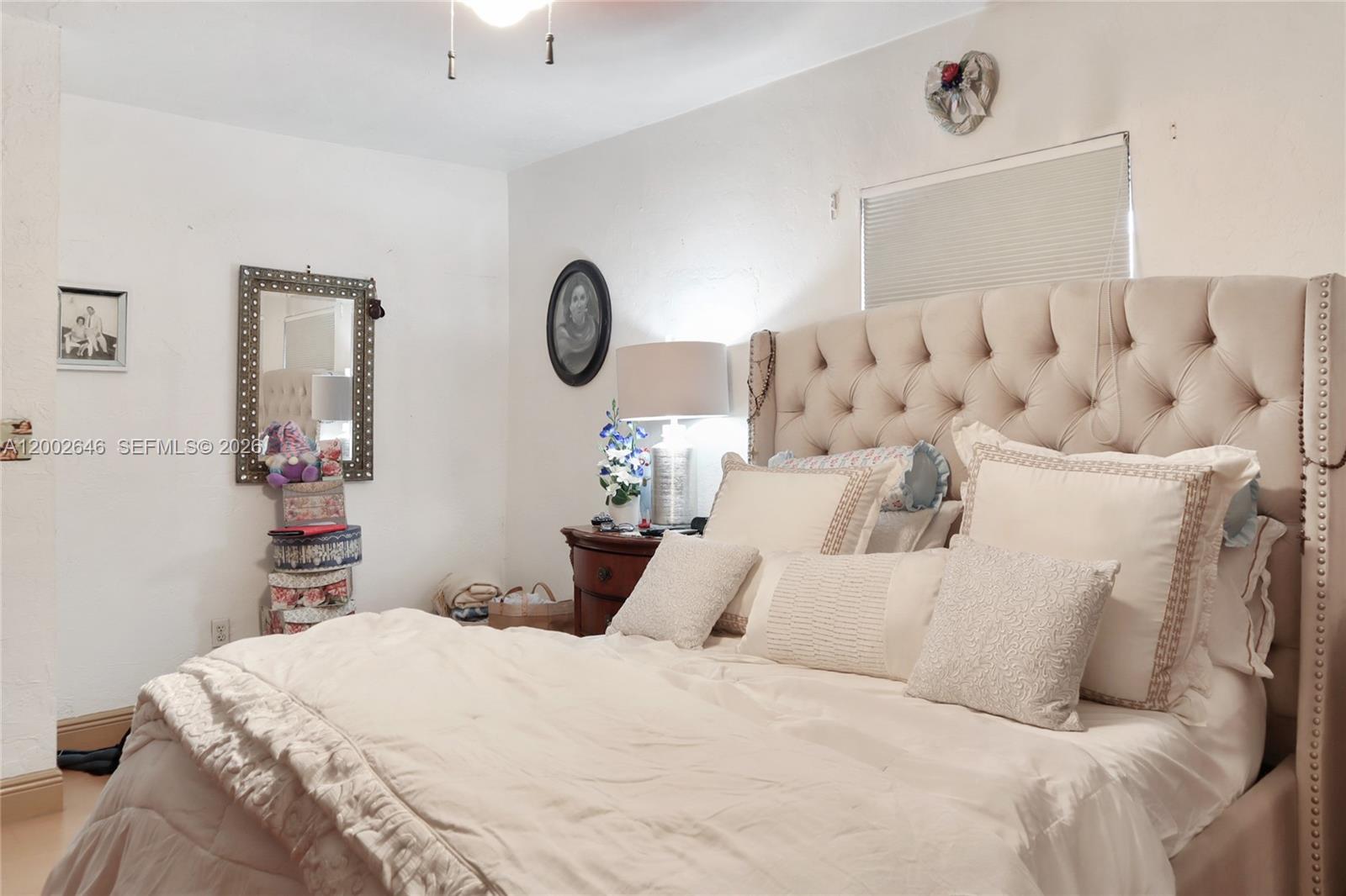 619 Southwest 39th Avenue Miami, FL 33134 - Photo 9 of 24 a bedroom with a bed and white walls