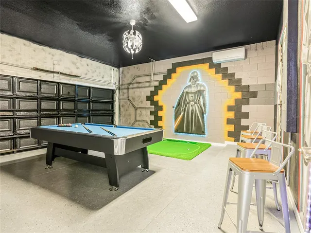 a living room with granite countertop furniture and a ceiling fan