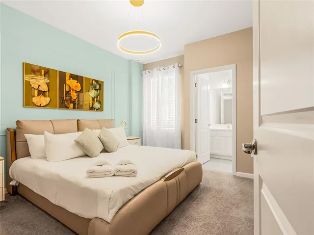 a bedroom with two beds and a window