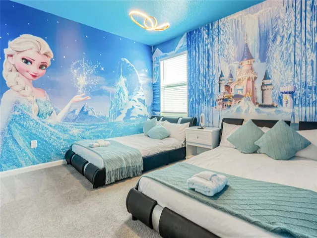 a bedroom with furniture and a window