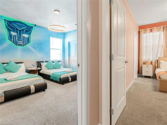 a bedroom with a bed and lamp