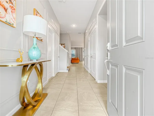 a view of a hallway with seating area