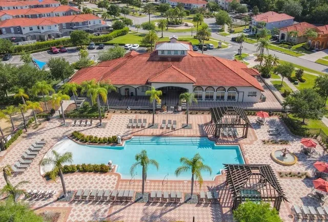 an aerial view of residential houses and outdoor space