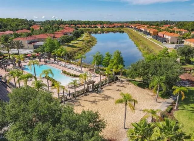 a view of a house with a yard and sitting area