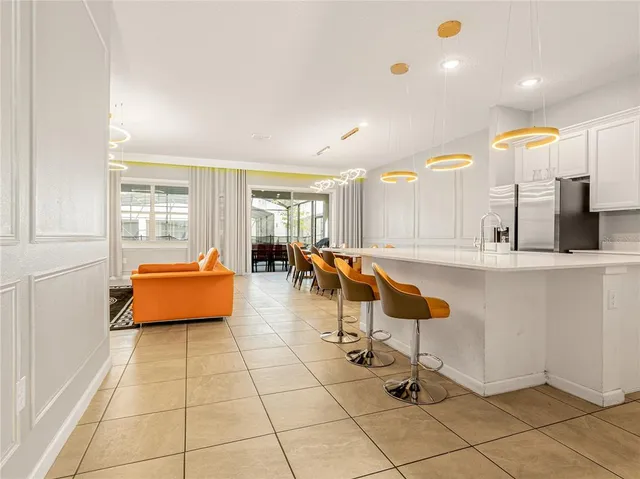 a room with gym equipment and view of living room