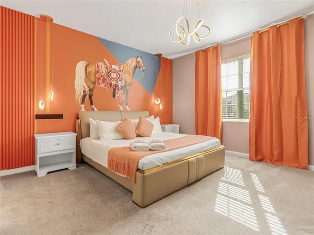 a bed room with a bed and a chair