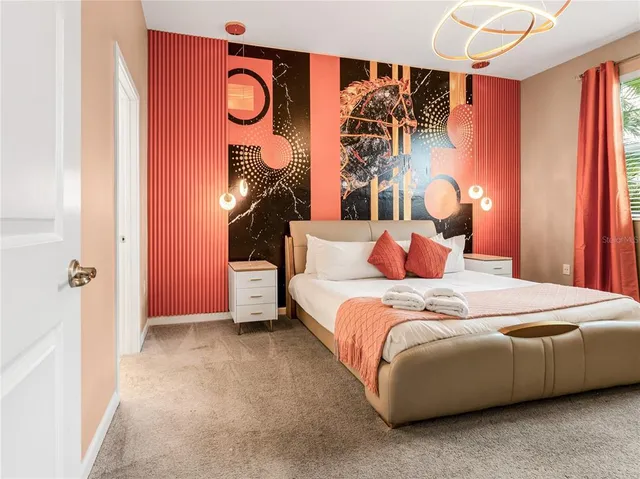 a bedroom with a bed and a lamp with the walls