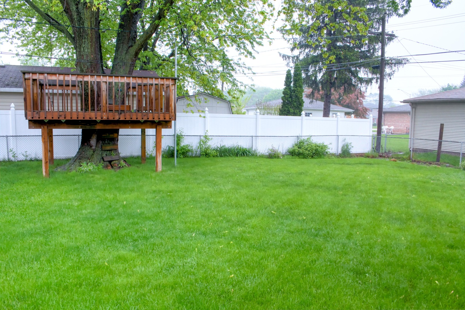 5917 108th Place Chicago Ridge, IL 60415 - Photo 29 of 34 a view of a wooden deck and a backyard