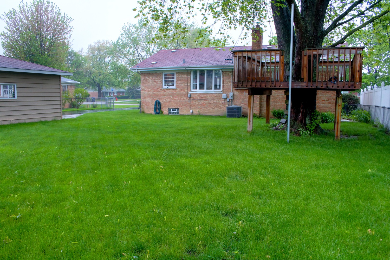 5917 108th Place Chicago Ridge, IL 60415 - Photo 30 of 34 a front view of a house with garden
