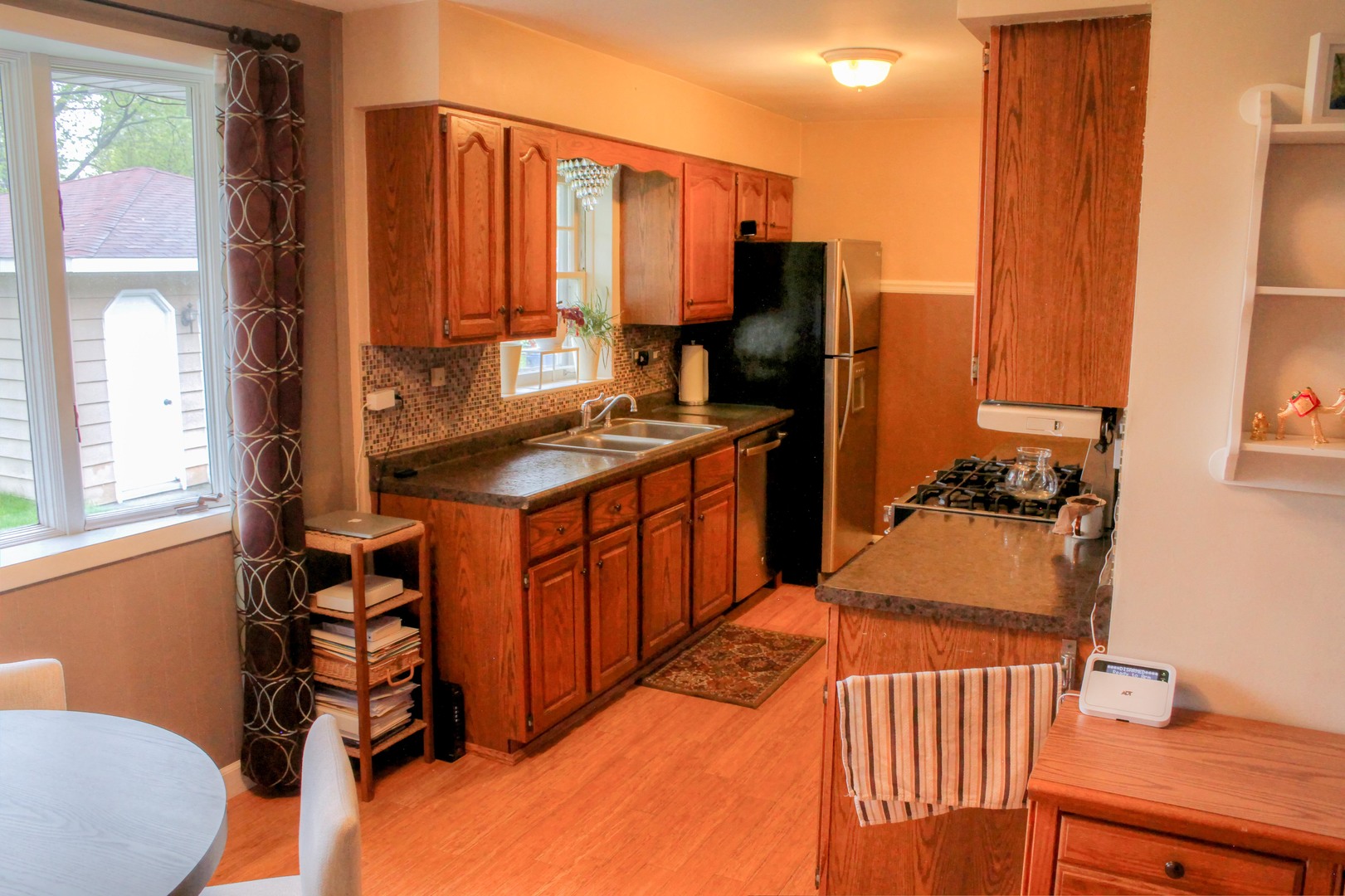 5917 108th Place Chicago Ridge, IL 60415 - Photo 10 of 34 a kitchen with stainless steel appliances a sink and a refrigerator