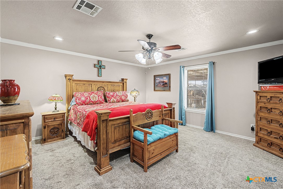 1601 Sunset Circle Cameron, TX 76520 - Photo 27 of 40 a bed room with a bed and a television