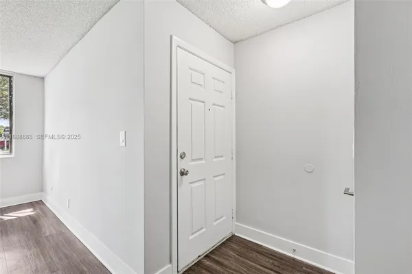 a kitchen with a sink cabinets and appliances