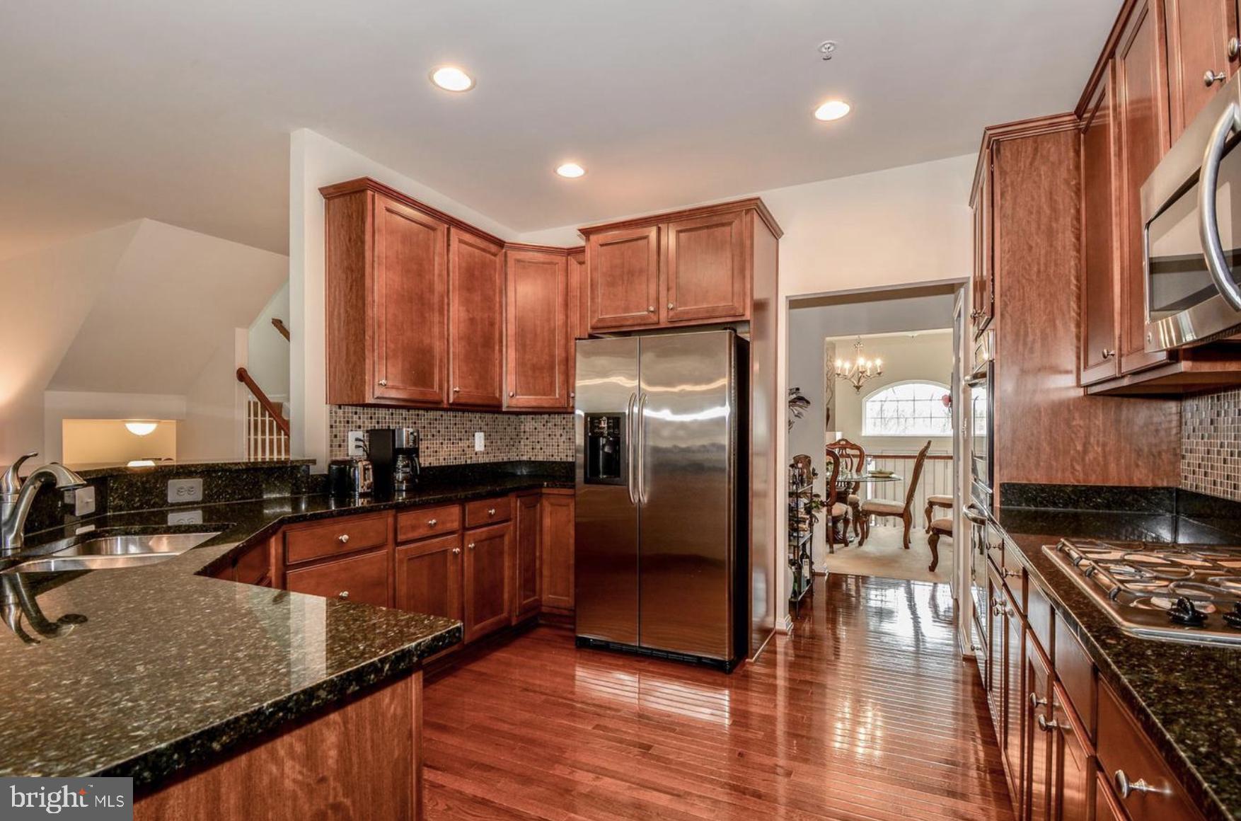 3321 Eagle Ridge Drive Woodbridge, VA 22191 - Photo 9 of 30 Elegant kitchen with rich wood tones.