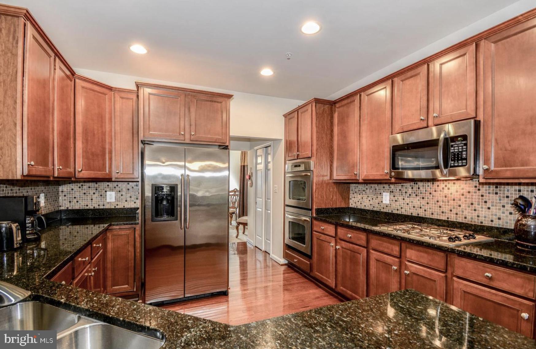 3321 Eagle Ridge Drive Woodbridge, VA 22191 - Photo 10 of 30 Modern kitchen with rich wood accents.