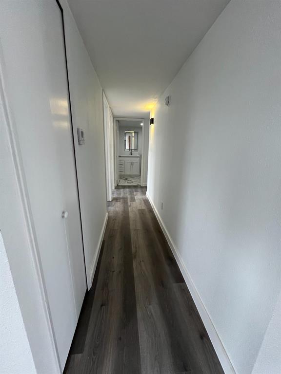 1105 Cherokee Trail Plano, TX 75023 - Photo 13 of 28 a view of a hallway with wooden floor