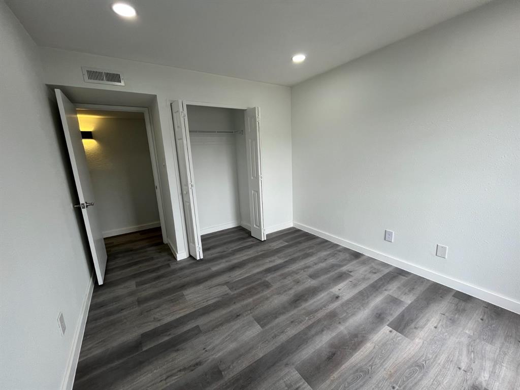 1105 Cherokee Trail Plano, TX 75023 - Photo 21 of 28 a view of a hallway with wooden floor
