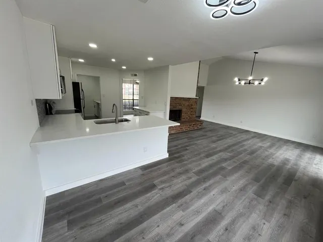 a view of a kitchen with a sink and a microwave