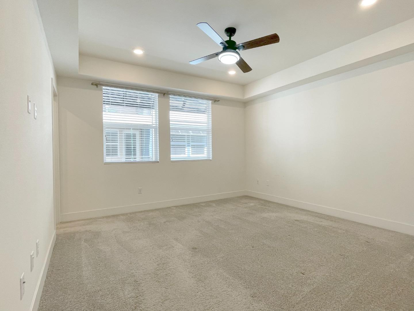 9600 Seawind Way Newark, CA 94560 - Photo 12 of 24 an empty room with a window and a fan