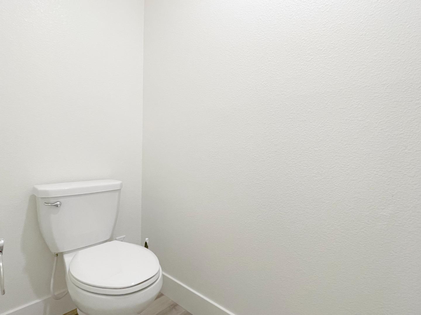 9600 Seawind Way Newark, CA 94560 - Photo 14 of 24 a white toilet sitting next to a white wall