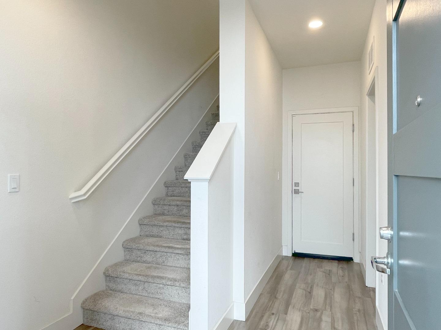 9600 Seawind Way Newark, CA 94560 - Photo 3 of 24 a view of entryway with stairs and wooden floor